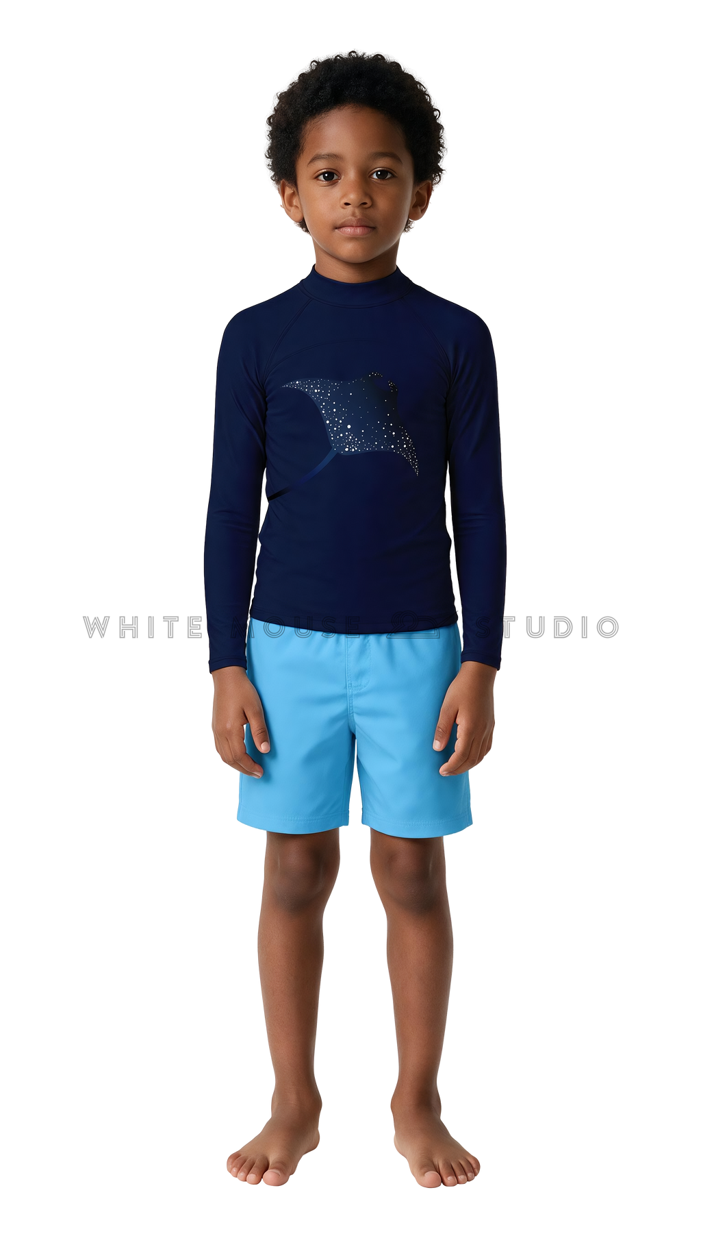 Boy wearing a long-sleeve rash guard with glowing manta ray print and swim shorts