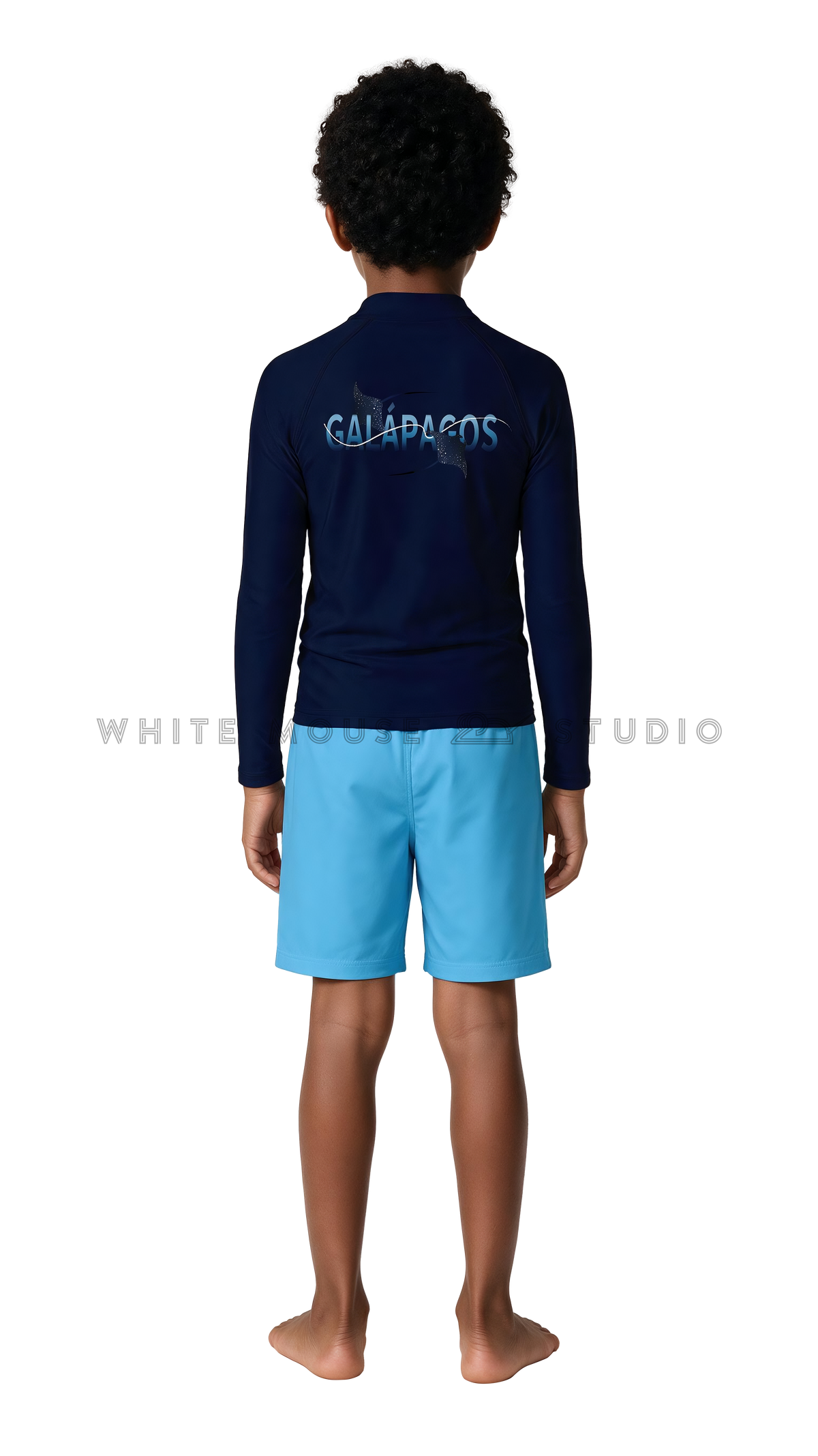 Boy wearing a long-sleeve rash guard with glowing manta ray print and swim shorts (back view)