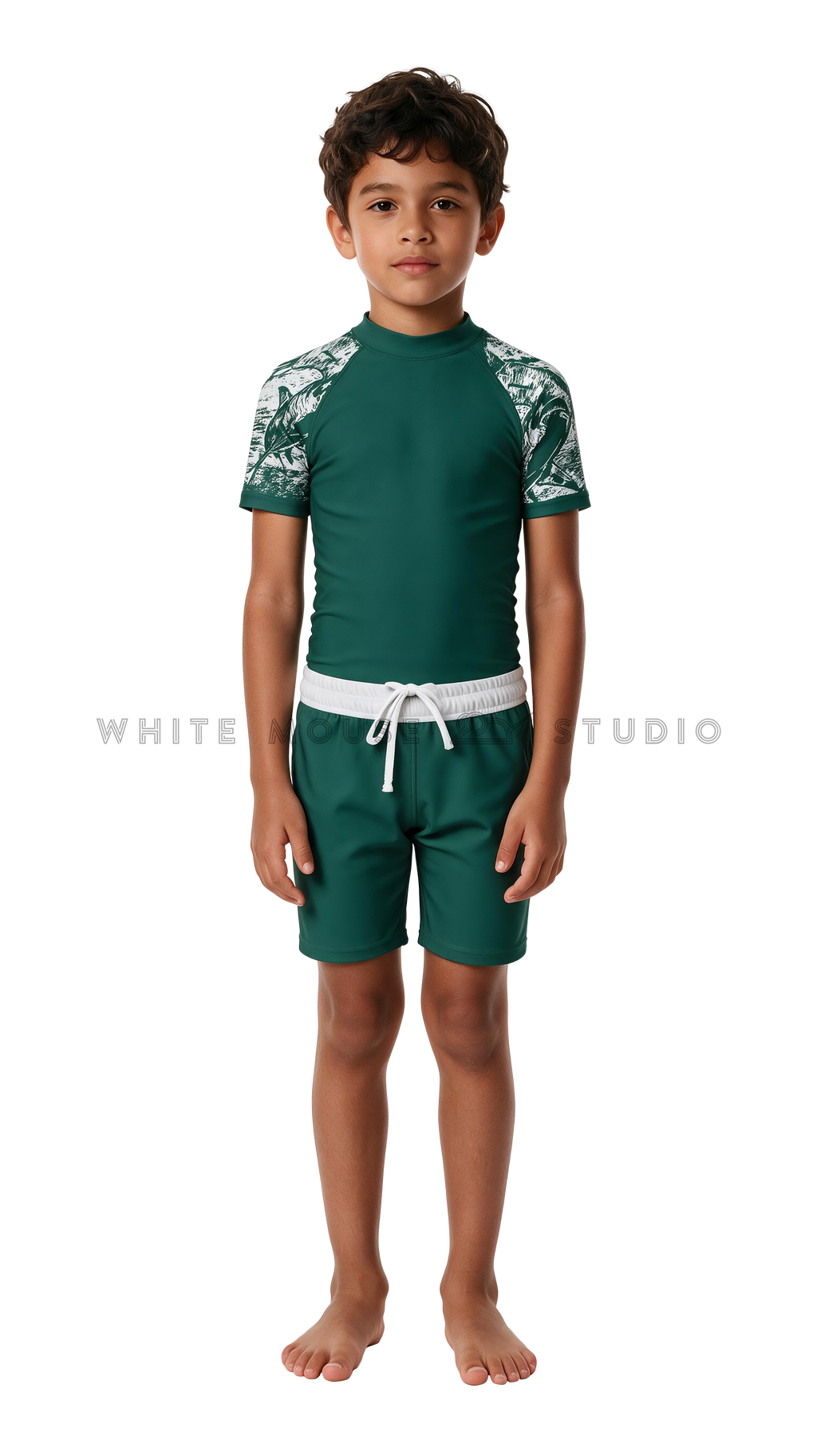 Boy wearing a short-sleeve rash guard with hammerhead shark print and swim shorts