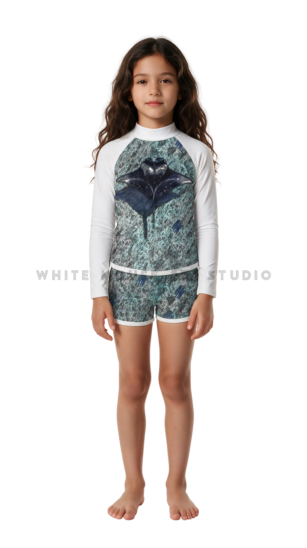 Girl wearing a long-sleeve rash guard with green ripple manta print and swim shorts