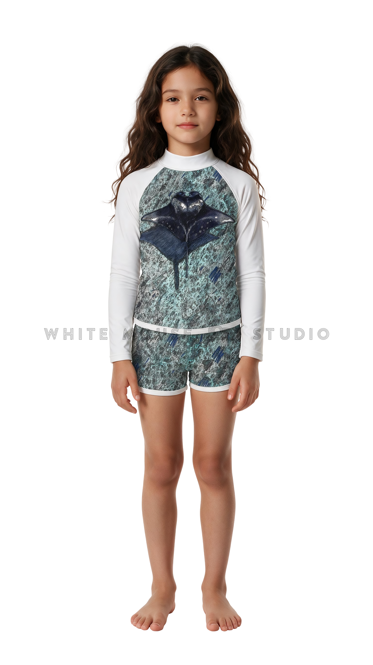 Girl wearing a long-sleeve rash guard with green ripple manta print and swim shorts