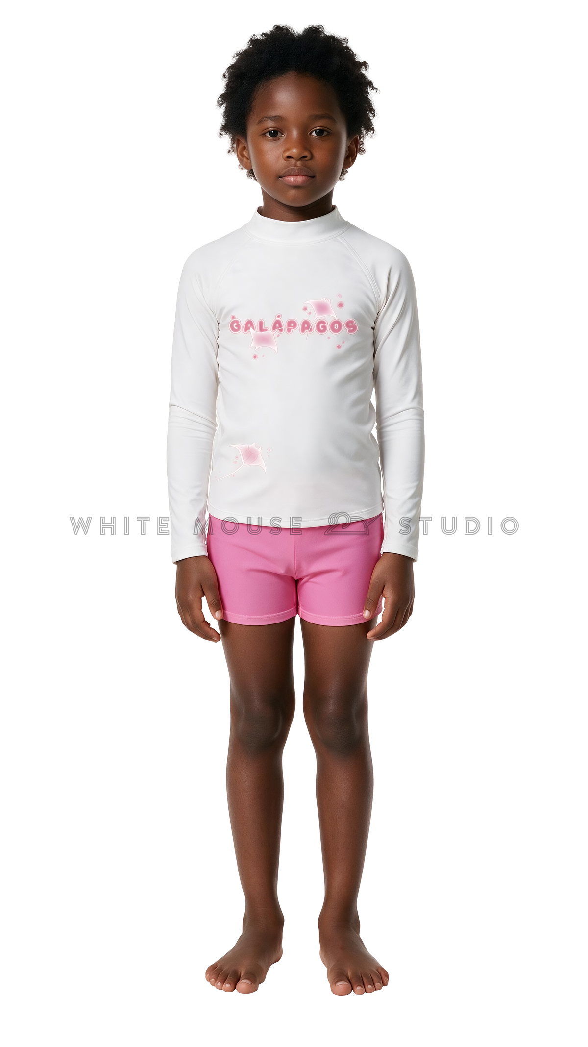 Girl wearing a long-sleeve rash guard with pink magical manta print and swim shorts
